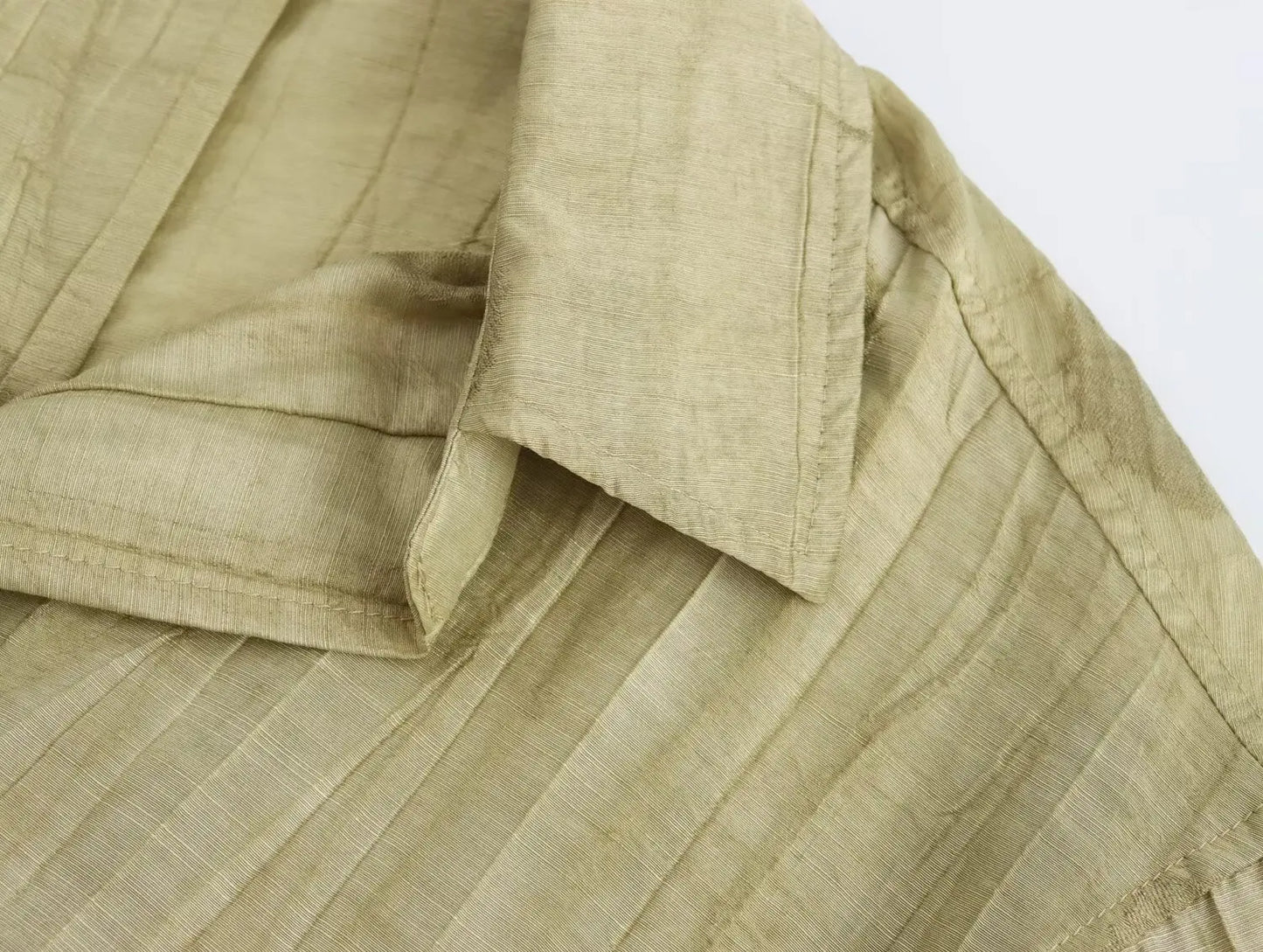 Two-piece dress pants and half-sleeved blouse.