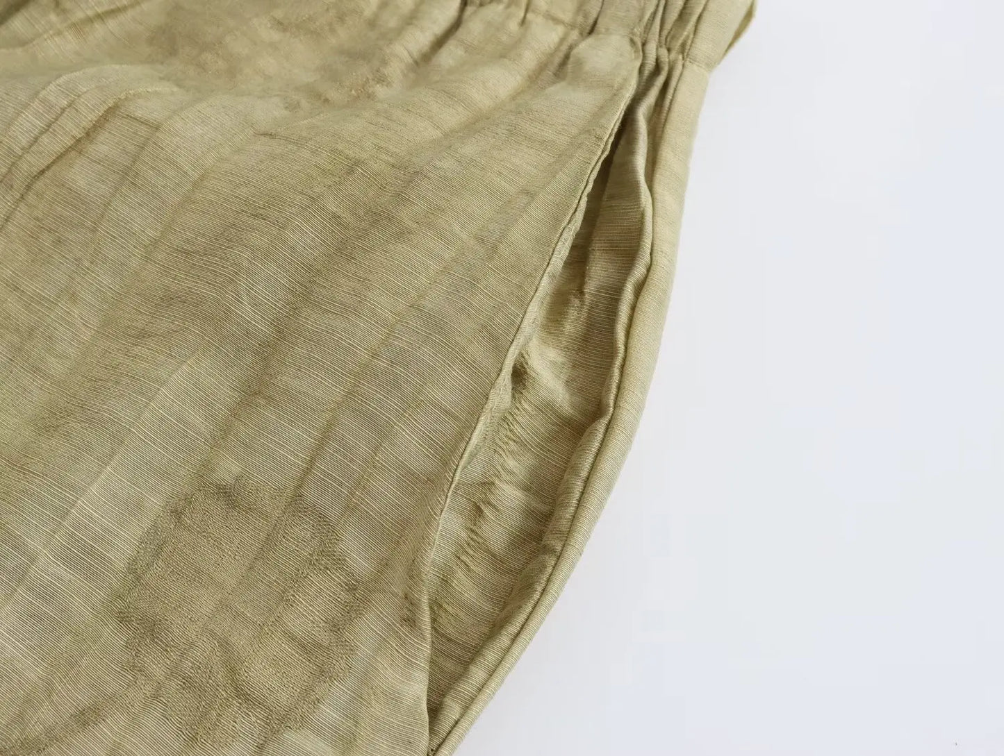 Two-piece dress pants and half-sleeved blouse.