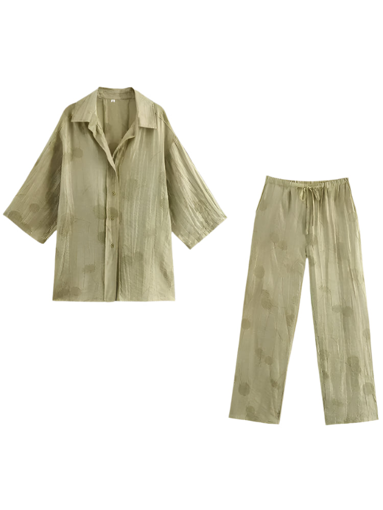 Two-piece dress pants and half-sleeved blouse.