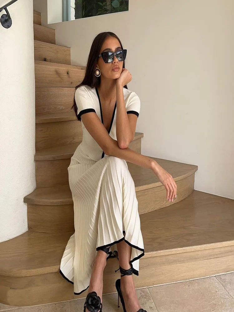 White long Skirt, Short Sleeve V-neck Crop Top.