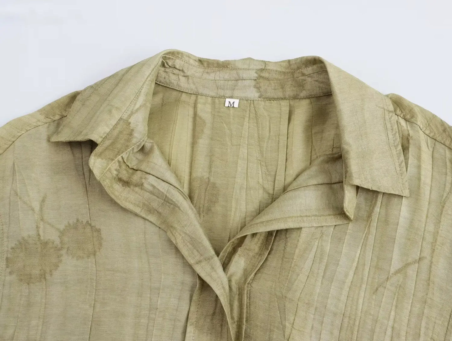 Two-piece dress pants and half-sleeved blouse.